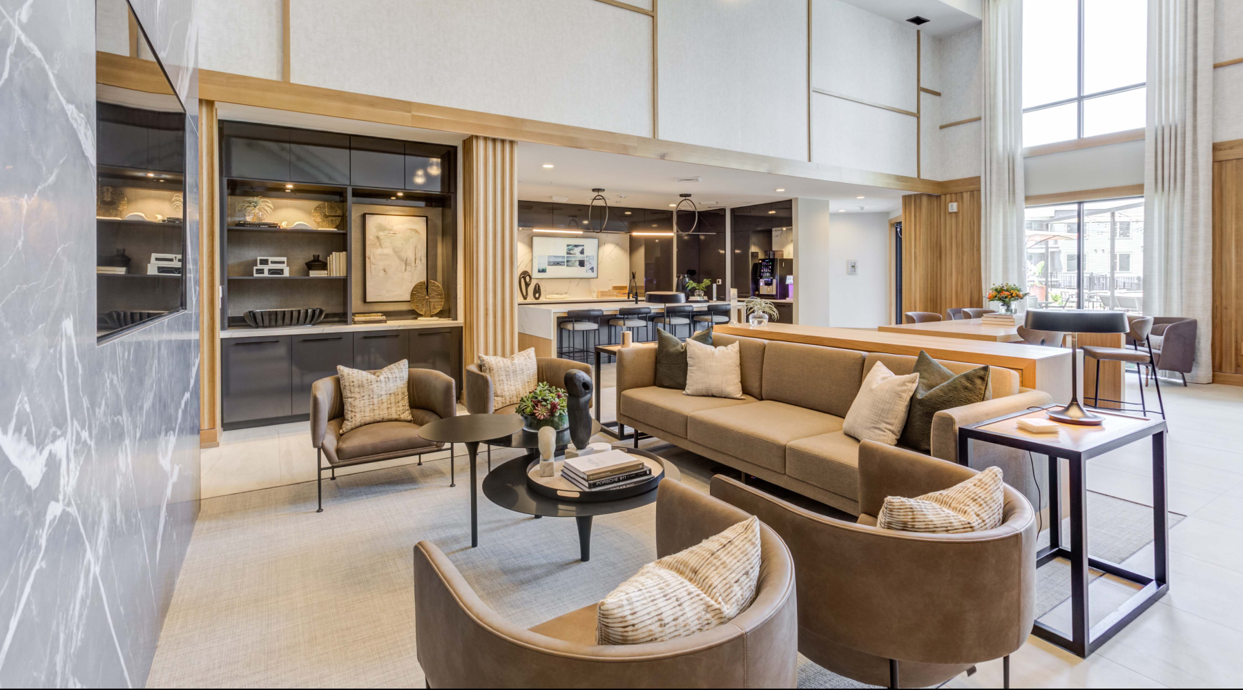 clubroom with soft seating, natural light and a coffee machine